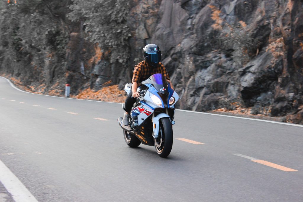 A person riding a motorcycle on a highway.